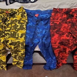 3 pairs or nike joggers, 2 are xl and 1 is medium